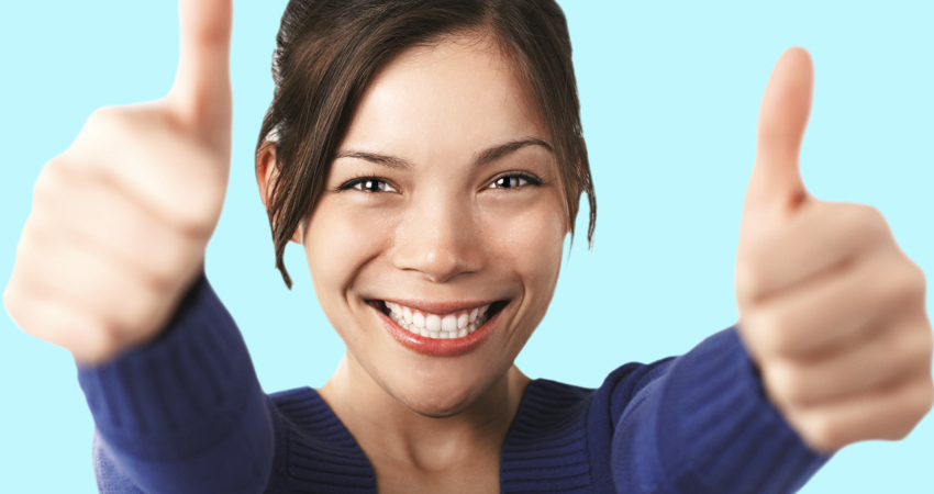 Woman with both her thumbs up