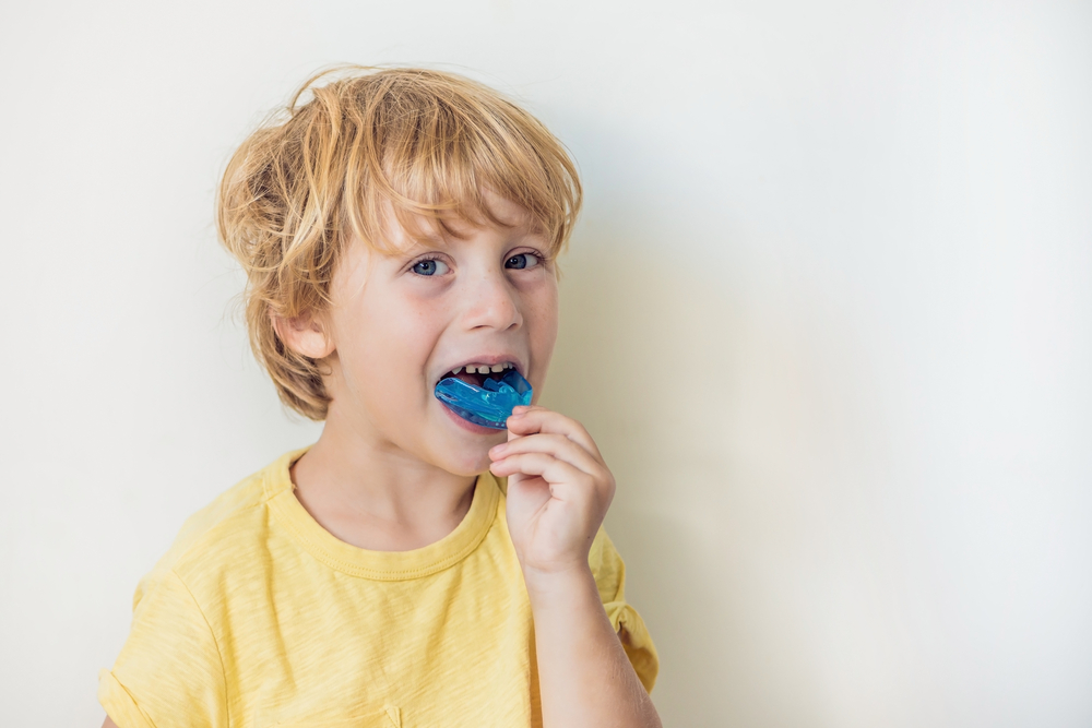 child wearing a mouth guard