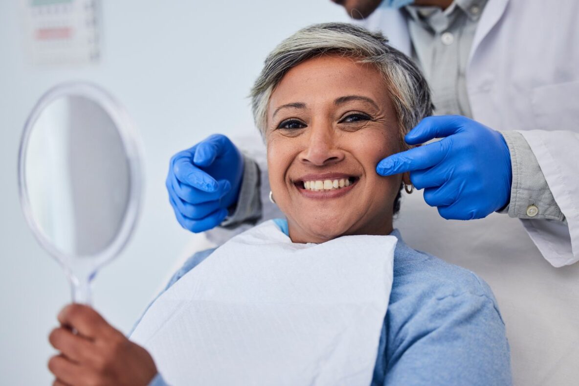 Smiling dental patient during a smile makeover consultation in Newton, MA